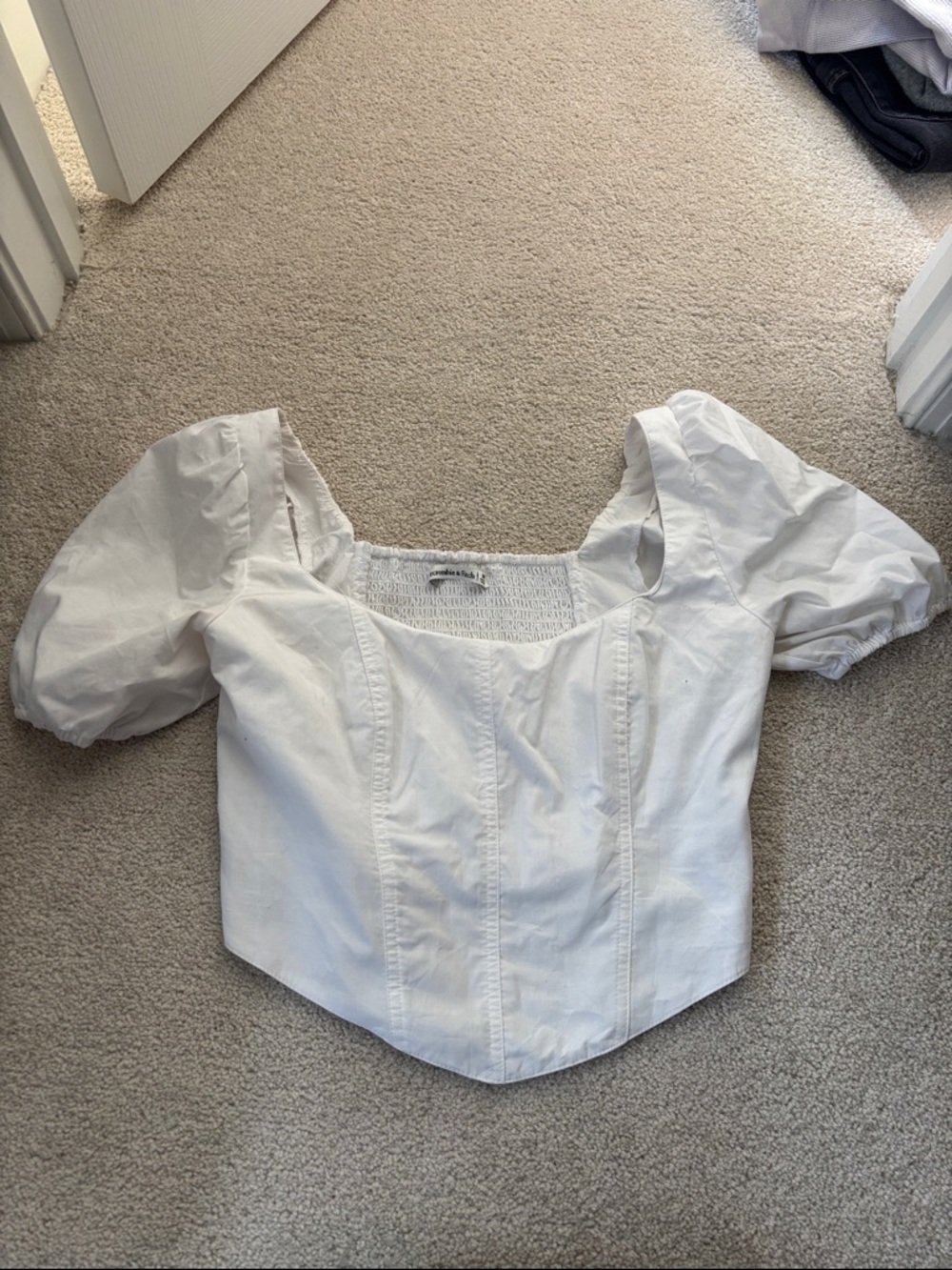 Cropped white top with puff sleeves